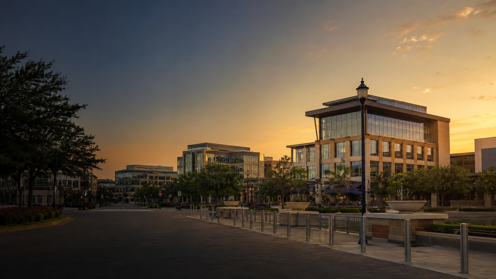 Frisco landmark district with modern mixed-use buildings at sunset